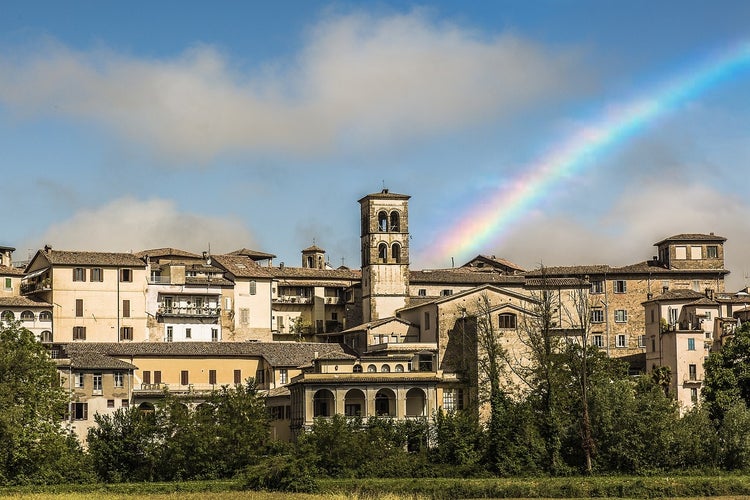 photo of a rainbow with panorama of Rieti in Italy.