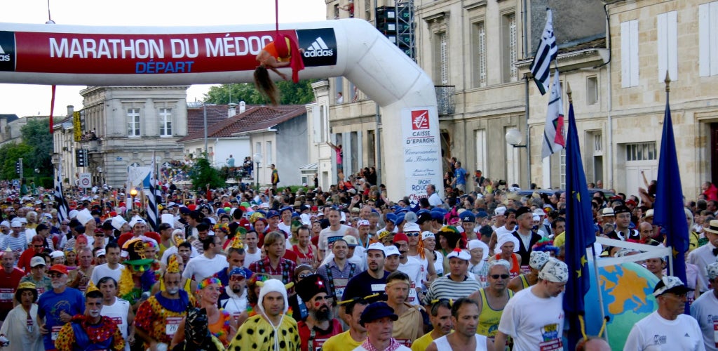 Costumed runners at the start line of the Marathon du Medoc in Pauillac, a festive wine-themed race held each September..jpg