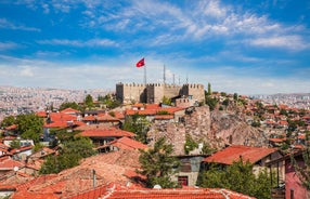 Hot air balloons flying over Uchisar Castle. Cappadocia. Nevsehir Province. Turkey.