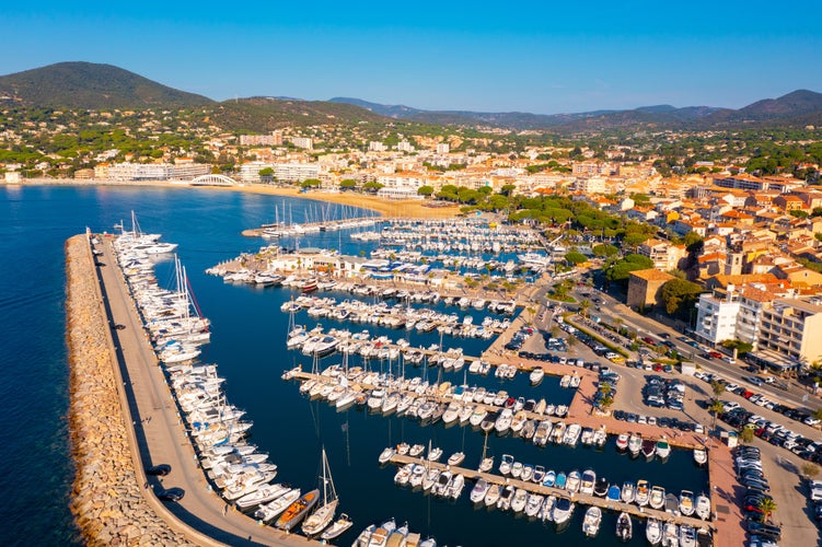 Summer aerial view of French coastal town of Sainte-Maxime on Mediterranean coast overlooking marina 