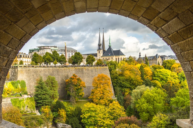 The view of iconic Gelle Fra and Notre-Dame cathedral in fall from the pedestrian walk under Adolphe bridge in Luxembourg.jpg