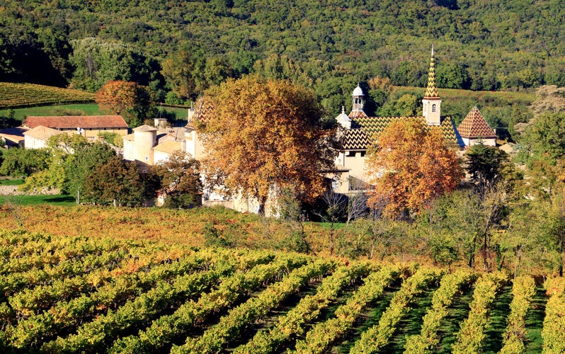 photo of view of The Chartreuse de la Valbonne surrounded by vineyards. Gard. Occitanie. la France.