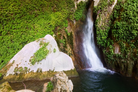 Photo of Waterfall in natural grot. Cuerva dal Agua near Tiscar. Spain .
