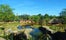 Photo of view of a traditional African landscape with straw huts in the steppe at the zoo Pairi Daiza, Belgium.