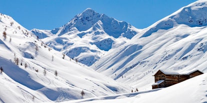 Photo of aerial view of Livigno town covered in snow in winter, Italy.