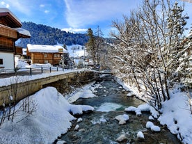 photo of an aerial view of Gstaad in winter. Village and holiday resort in the Swiss Alps.