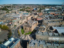 Photo of beautiful view of the old town city of Edinburgh from Calton Hill, United Kingdom.