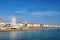 Photo of panoramic view along Brighton Beachfront with the promenade and Ferris Wheel backed by highrise buildings, UK.