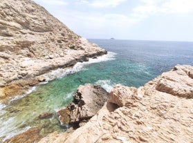 Photo of aerial panoramic view coastline and La Vila Joiosa Villajoyosa touristic resort townscape, sandy beach and Mediterranean seascape, Costa Blanca, Spain.