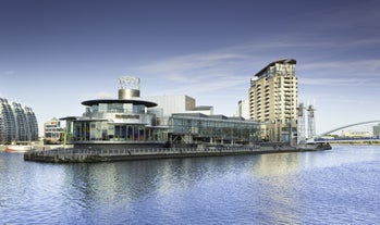 Aerial drone view of Manchester city in UK on a beautiful sunny day.