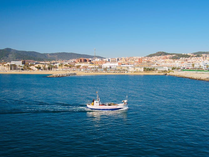 boat sailing off Mataro's beach