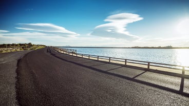 Photo of Beach seashore with wooden path to sea water in San Pedro del Pinatar