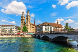 Panoramic view of historic Zurich city center with famous Fraumunster, Grossmunster and St. Peter and river Limmat at Lake Zurich on a sunny day with clouds in summer, Canton of Zurich, Switzerland