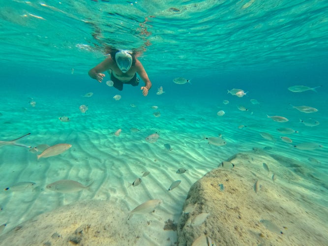 Snorkeler in the Blue turquoise underwater view of tropical beach Formentera Ibiza Balearic islands in Spain.jpg