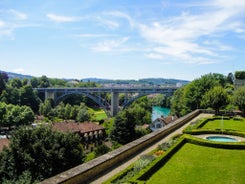 Bern, Switzerland. View of the old city center and Nydeggbrucke bridge over river Aare.