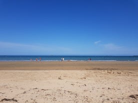 Photo of aerial view of the long sandy beach of Sword beach in Hermanville-sur-Mer towards Ouistreham ,France.