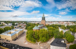 Aerial view of the Tampere city at sunset. Tampella building. View over Tammerkoski river in warm sunlight.