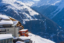 Photo of The mountain village at the Austrian ski resort Soelden on a cold and sunny winter day.