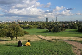 London, England - Panoramic skyline view of Bank and Canary Wharf, central London's leading financial districts with famous skyscrapers at golden hour sunset with blue sky and clouds.