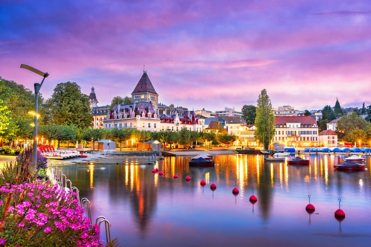 Photo of Lausanne from the Ouchy Promenade on Lake Leman at twilight, Switzerland.