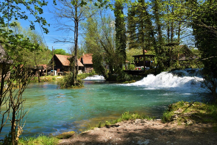 photo of view of View of Korana river flowing through the town of Slunj in Karlovac county, Croatia in summer