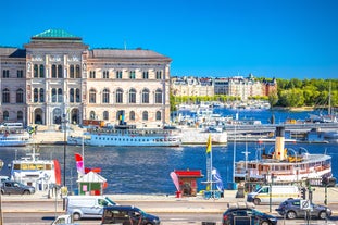 Photo of landscape with mountains, river and buildings in Lillehammer town, Norway.