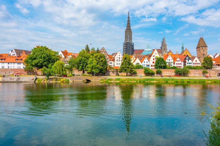 Cityscape of German town Ulm reflecting on river Danube.