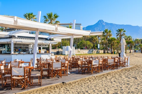 Bar on beautiful beach in Marbella town near Puerto Banus marina, Costa del Sol, Spain