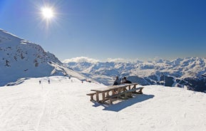 Photo of aerial view of beautiful winter landscape of Les Deux Alpes surrounded by mountains, France.