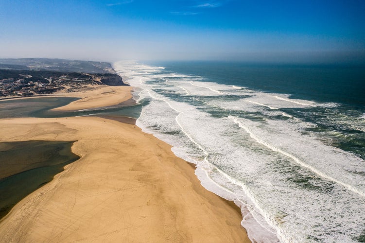 Foz do Arelho Beach, in Caldas da Rainha, Portugal. Sea and sandy landscape with fog. Aerial View