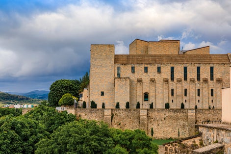 photo of Royal and General Archive of Navarra surrounded by medieval city walls in old town Pamplona, Navarra, Spain.
