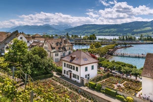 Panoramic view of historic Zurich city center with famous Fraumunster, Grossmunster and St. Peter and river Limmat at Lake Zurich on a sunny day with clouds in summer, Canton of Zurich, Switzerland