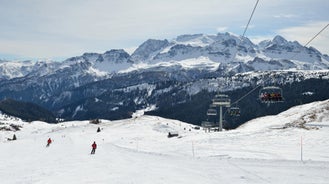 photo of Ski Resort of Corvara on a sunny day, Alta Badia, Dolomites Alps, Italy.