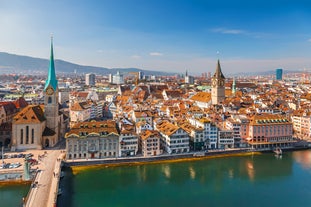 Panoramic view of historic Zurich city center with famous Fraumunster, Grossmunster and St. Peter and river Limmat at Lake Zurich on a sunny day with clouds in summer, Canton of Zurich, Switzerland