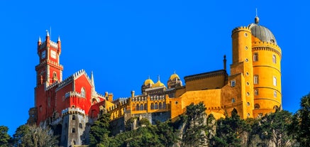 Photo of Baroque facade of Queluz National Palace and Neptune Fountain in Sintra, Lisbon district, Portugal.