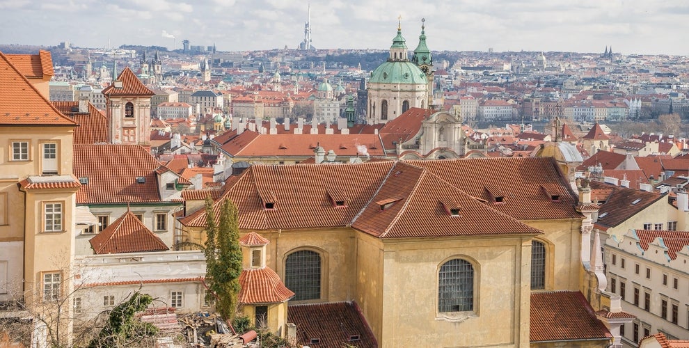 Rooftop view of Prague with historic churches and towers, a scenic highlight of Czechia in July..jpg