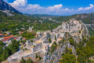 photo of a beautiful panoramic view of Kastel Luksic harbor and landmarks summer view, Split region of Dalmatia, Croatia.