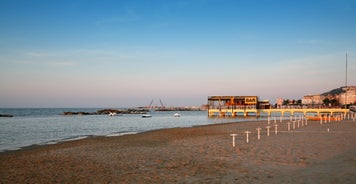 Photo of amazing landscape with beautiful sea beach on sunset in Viserbella, Italy.