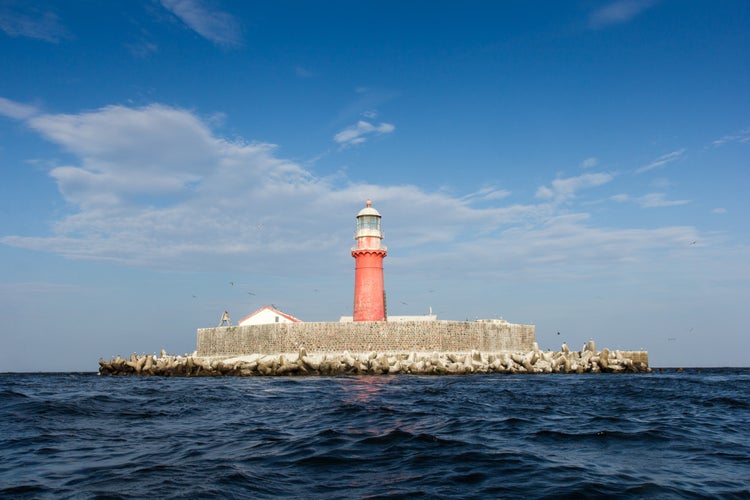 photo of view of The Kolka lighthouse is on an artificial island in six kilometres from Kolkasrags.