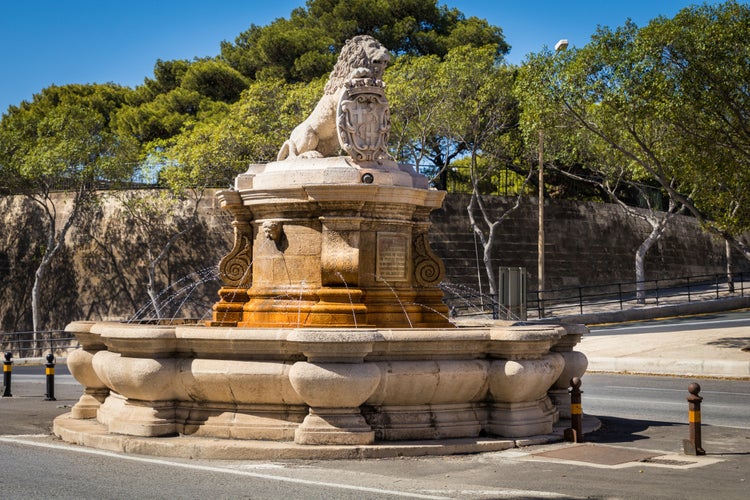 Photo of the Lion Fountain, a baroque fountain topped by a lion, guarding the entrance to Floriana, Valletta, Malta.