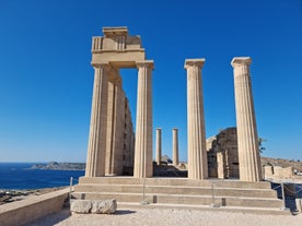 Photo of panoramic aerial view of Lindos bay, village and Acropolis, Rhodes, Greece.