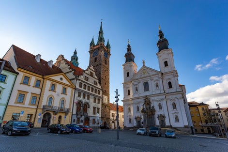 Photo of black Tower and Church of Virgin Mary's Immaculate Conception in Klatovy, Czechia.