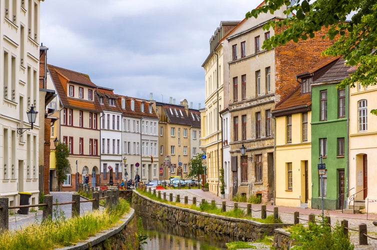 On the streets of Wismar old town. Colorful houses along the canal of Grube river, Wismar city, Mecklenburg-Vorpommern state, Germany