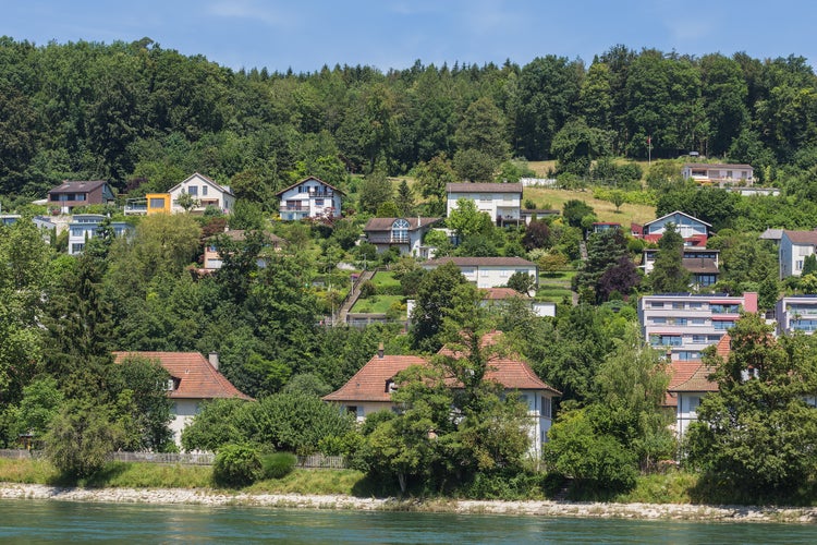 Photo of buildings of the town of Aarau along the Aare river in summertime, Switzerland.