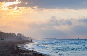 Photo of Sand beach and historical Old Town in mediterranean resort Sitges near Barcelona, Costa Dorada, Catalonia, Spain.