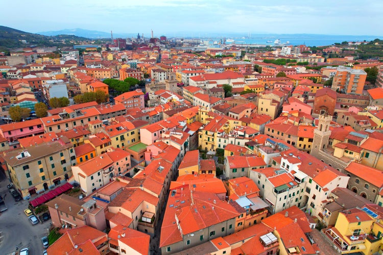 Photo of aerial view of the beautiful coastal town Piombino, Italy.