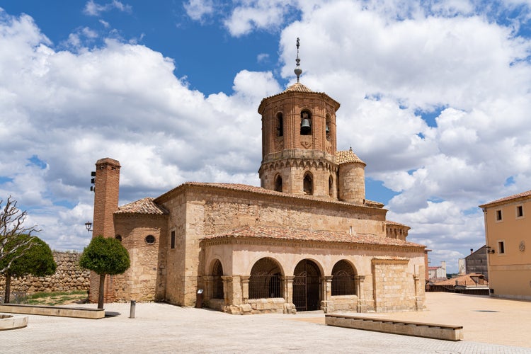 Photo of Romanesque church of San Miguel in the main square of Almazan in Soria, Spain.