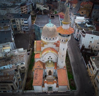 Photo of Aerial view of the The Great Mahmudiye Mosque (Carol I) in Constanta city, Romania. Located in the history center of the old town in the city. famous architecture and religious monument.