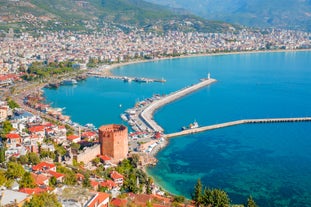 Photo of Kizil Kule or Red Tower and port aerial panoramic view in Alanya city, Antalya Province on the southern coast of Turkey.