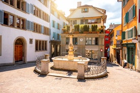 View of the Old Town of Basel with red stone Munster cathedral and the Rhine river, Switzerland.